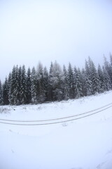 Fototapeta premium Snowy road in Sudety mountains, Poland