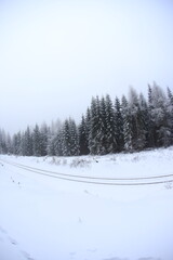 Fototapeta na wymiar Snowy road in Sudety mountains, Poland