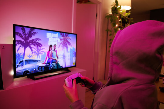 New Grand Theft Auto VI for PlayStation 5. Sony PS5 console. Dualsense controller. Man holding joystick and ready to play upcoming GTA 6 game