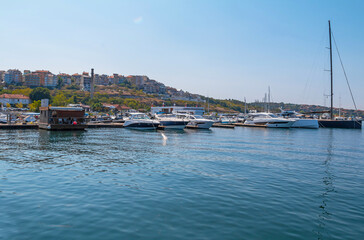 Fototapeta na wymiar Sozopol, Bulgaria. A view of the seaside port with yachts and fishing boats. Vacation time.