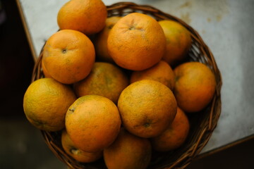 Close up shot of Kinnow Oranges in wooden basket © ravinepz