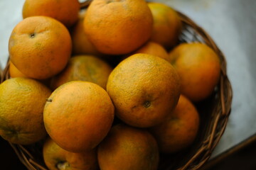 Close up shot of Kinnow Oranges in wooden basket © ravinepz