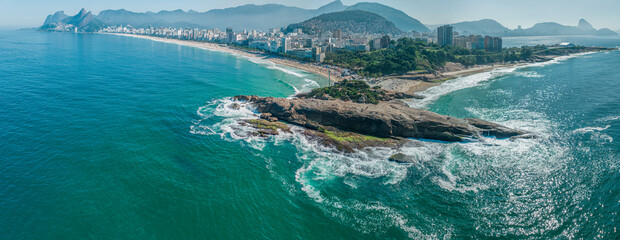 Aerial view of Diabo beach and Ipanema beach, Pedra do Arpoador. People sunbathing and playing on...