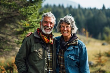 Fototapeta premium happy elderly couple standing peacefully in the field