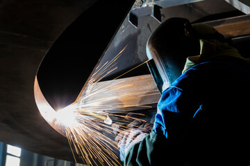 factory welder - industrial welding of metal parts - welding with long exposure time