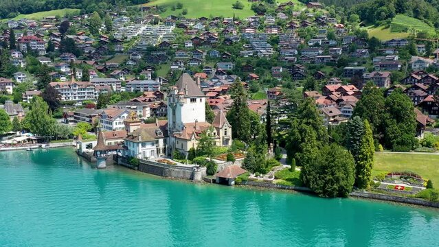 Oberhofen Castle at Lake Thunersee in swiss Alps, Switzerland. Schloss Oberhofen on the Lake Thun (Thunersee) in Bern Canton of Switzerland. Oberhofen castle on Lake Thun, Switzerland.