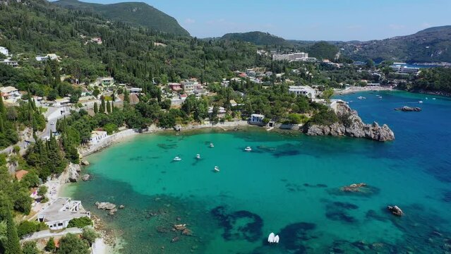Picturesque seaside of Paleokastritsa, Corfu, Greece. Beautiful bay in Paleokastritsa in Corfu island, Greece. Panoramic view of Palaiokastritsa, boats and beach Corfu, Greece
