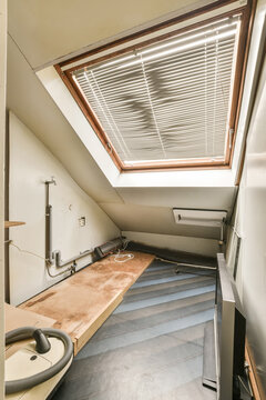 Garret room with window and television