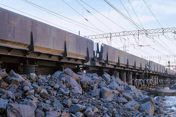 Moving of opened freight dump rail cars on railroad