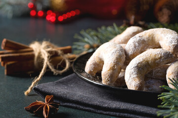 Christmas horseshoe cookies, bagels with powdered sugar. Christmas tree branches for decoration....