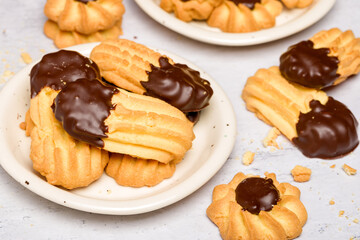 Chocolate shortbread cookies. Light background. Selective focus