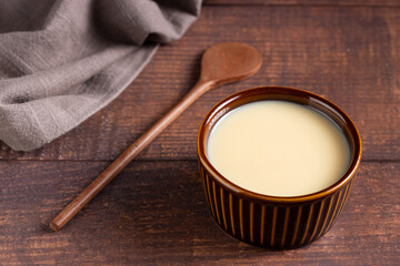 Fresh condensed milk in the bowl.