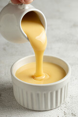 Fresh condensed milk in the bowl.
