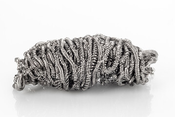 Metal sponge for cleaning pots isolated on white