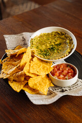 Delicious crispy tortilla chip with salsa sauce and guacamole - 705233750