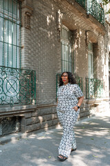 Fototapeta na wymiar African American woman exploring the city on summer vacation
