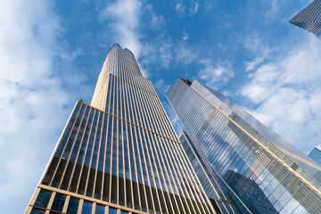 Skyscraper in metropolis city. City downtown with skyscraper. Office building in business district. Skyscraper building architecture. Skyscraper architectural style. Modern glass building