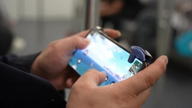 playing video game on mobile phone