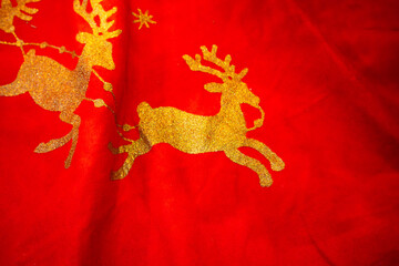 Close up photo of a reindeers on a Christmas tree skirt