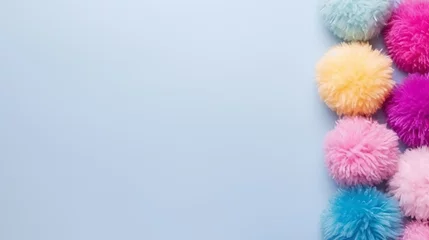 Fotobehang A set of colorful pom-poms with a high angle and copy space. © Elchin Abilov