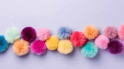 A set of colorful pom-poms with a high angle and copy space. - obrazy, fototapety, plakaty