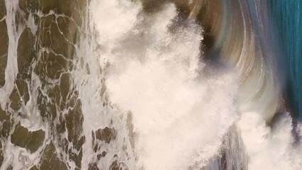 Aerial view of Beautiful sea water spray splash. Huge ocean wave slow motion. vertical - Powered by Adobe