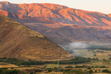 Beautiful sunset over the Caucasus mountains. Jeghenadzor, Armenia. - 705252598