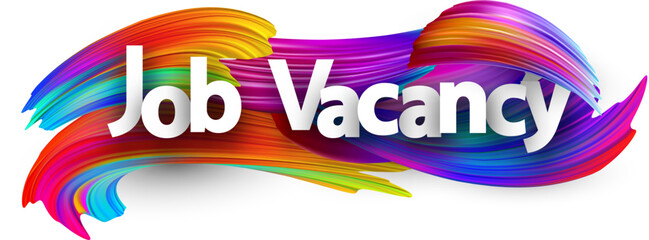 Job vacancy paper word sign with colorful spectrum paint brush strokes over white.