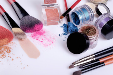 Professional cosmetics and brushes for make-up on a white background
