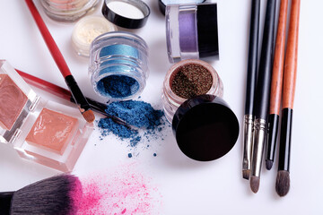 Professional cosmetics and brushes for make-up on a white background