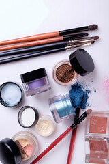 Professional cosmetics and brushes for make-up on a white background