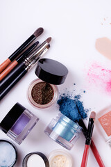 Professional cosmetics and brushes for make-up on a white background