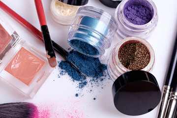 Professional cosmetics and brushes for make-up on a white background