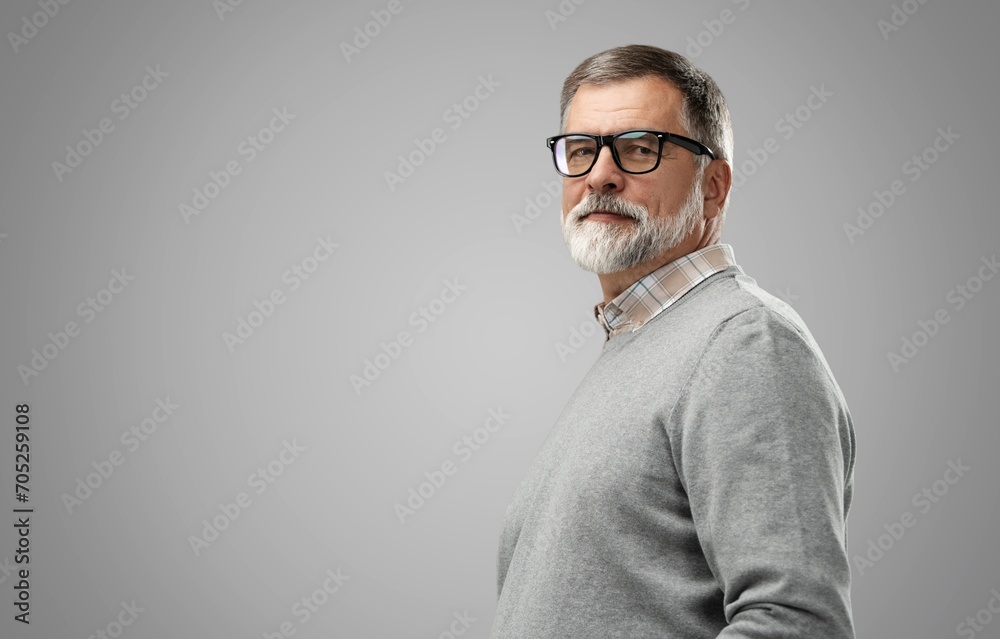 Wall mural Portrait of happy casual mature man smiling, senior age man with gray hair, Isolated on gray background