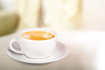 Tasty hot coffee cappuccino with milk in cup