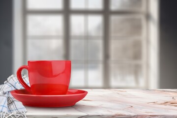A cup of tasty hot tea on the windowsill