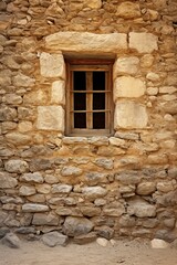 Fototapeta na wymiar ancient bright textured greek stone wall with a window