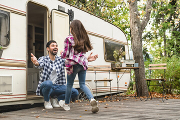 Happy cheerful father playing spending time with preteen daughter, traveling together by camper van...