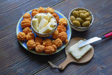 Balkan cuisine. Priganice - small fried cakes, donuts. Local cheese and olives