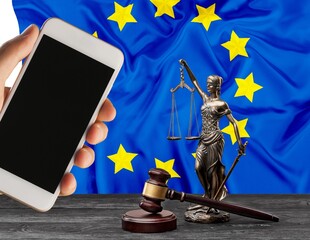 Modern smartphone, court wooden gavel and EU flag