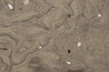 Natural pattern on the beach sand, black and white.