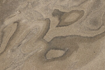 Natural pattern on the beach sand, black and white.