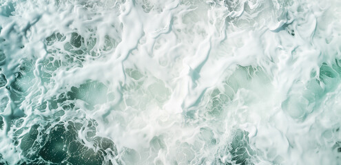 Blue ocean water texture background. Turquoise foamy surface of the sea with wave.
