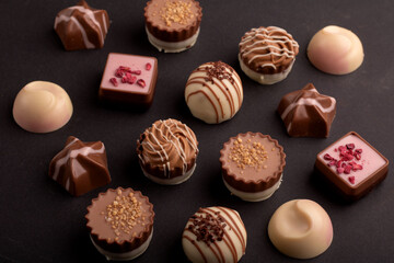 photo captures the irresistible allure of a diverse chocolate assortment. Each piece promises a...