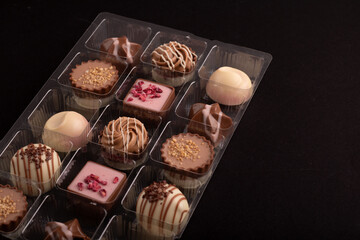 assortment of chocolates in a captivating box. Each piece promises a symphony of flavors