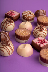 photography, a mixed assortment of candies creates a visually appealing array. The sweet and indulgent treats promise a delightful experience against a captivating background