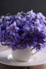  this vertical photo, a vibrant bouquet of wildflowers, violet in hue, captures the essence of early spring. The image embodies the season's growth