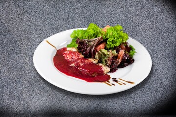 Modern style tasty traditional cooked meat with sauce