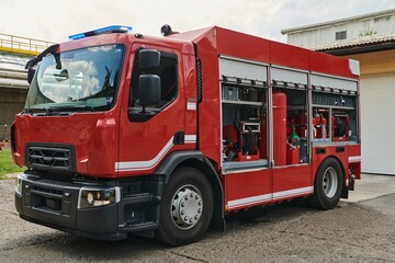 Fototapeta na wymiar A state-of-the-art firetruck, equipped with advanced rescue technology, stands ready with its skilled firefighting team, prepared to intervene and respond rapidly to emergencies, ensuring the safety