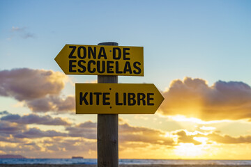 Sign in spanish at beach navigate surfing school and kitesurf